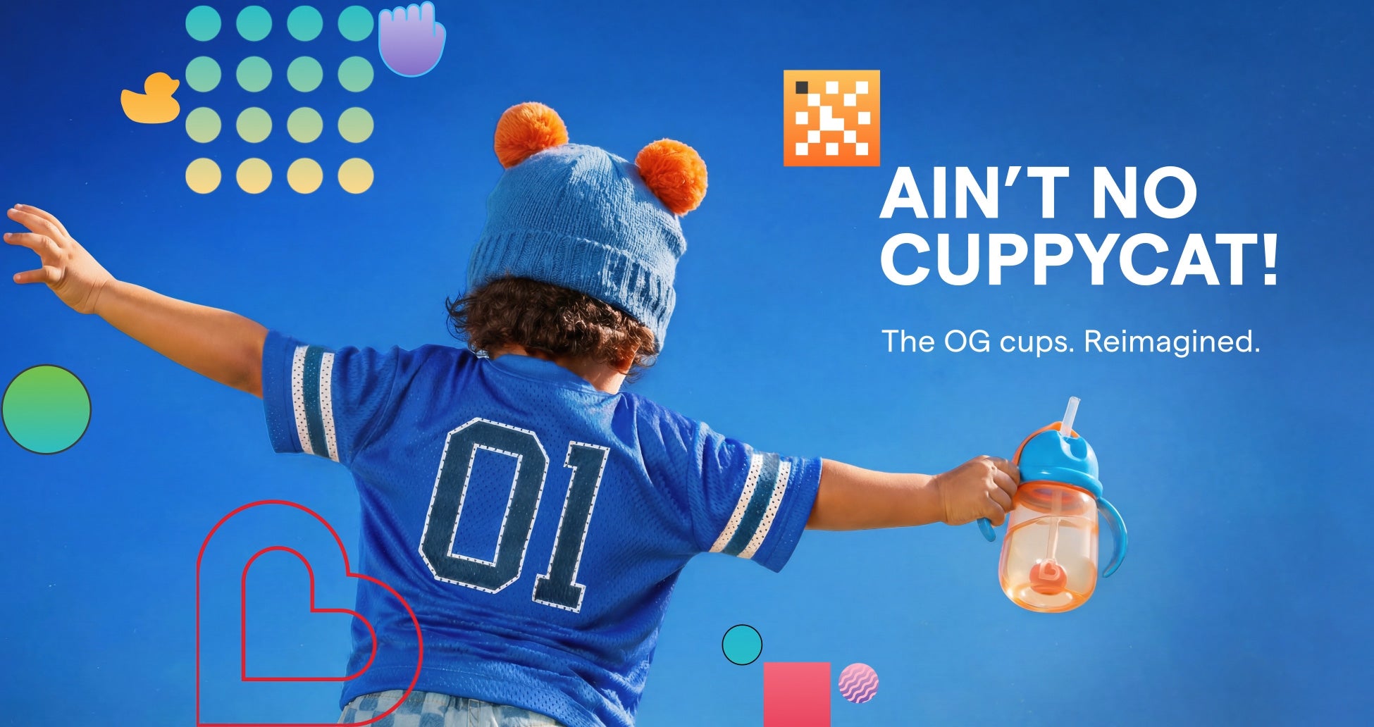 Toddler holding a Munchkin sippy cup with Ain't No Cuppycat campaign text