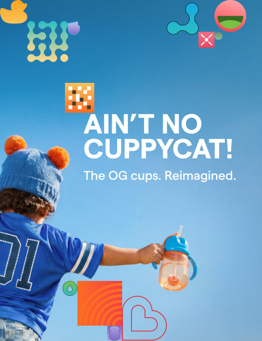Toddler holding a Munchkin sippy cup with Ain't No Cuppycat campaign text
